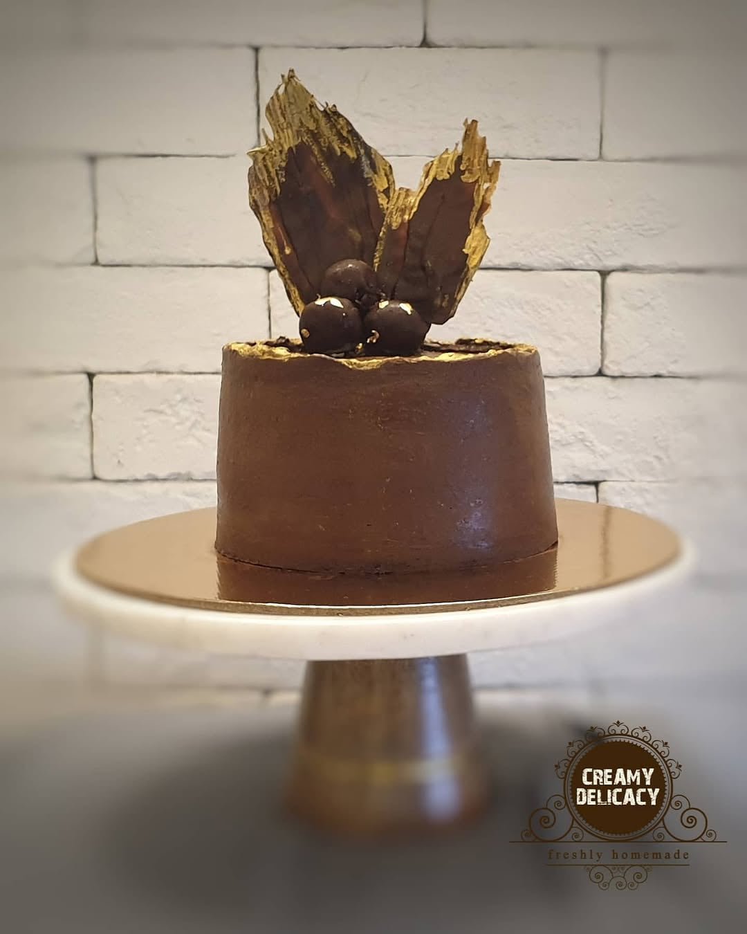 Belgian chocolate truffle cake on a cake stand