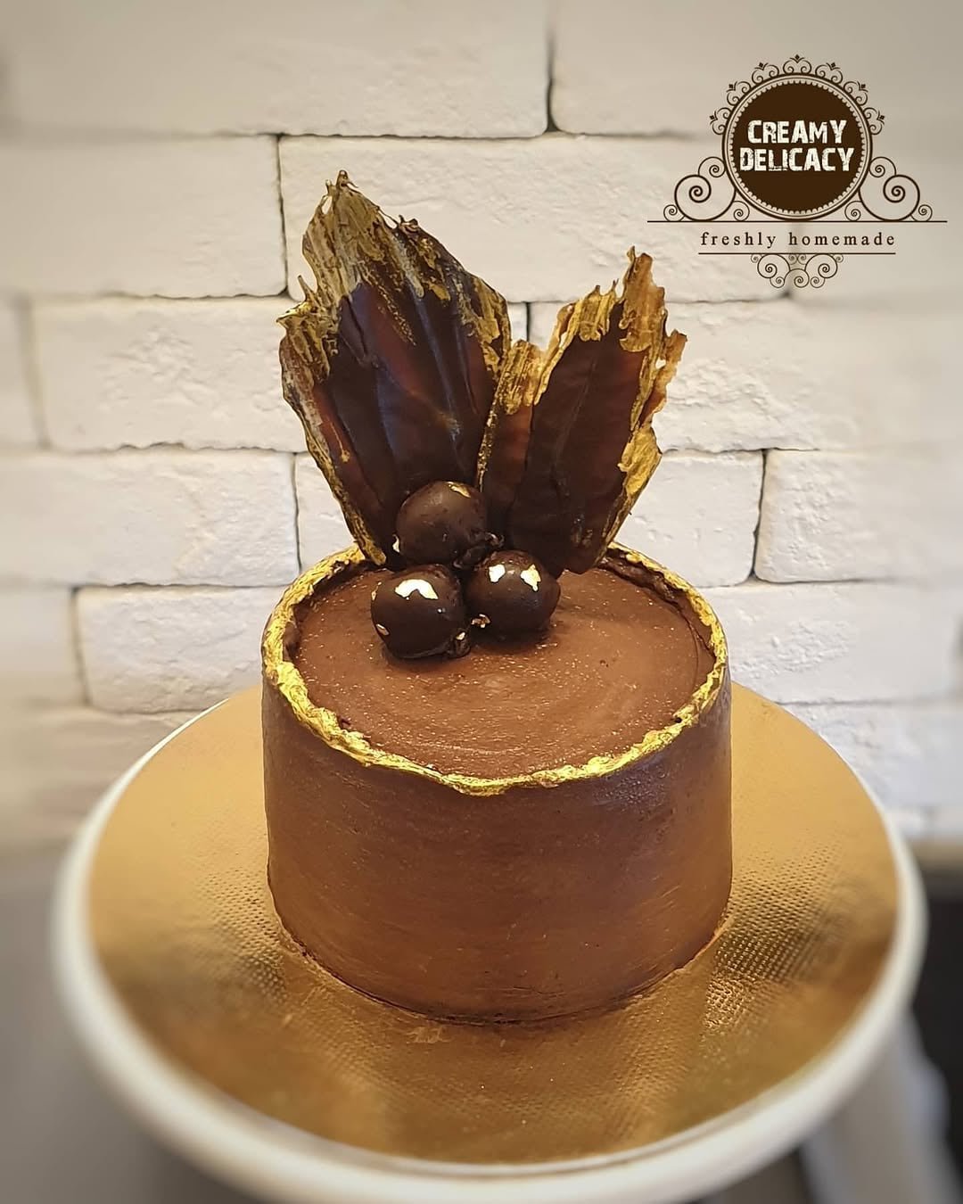 Belgian chocolate truffle cake crowned with chocolate sails and truffles