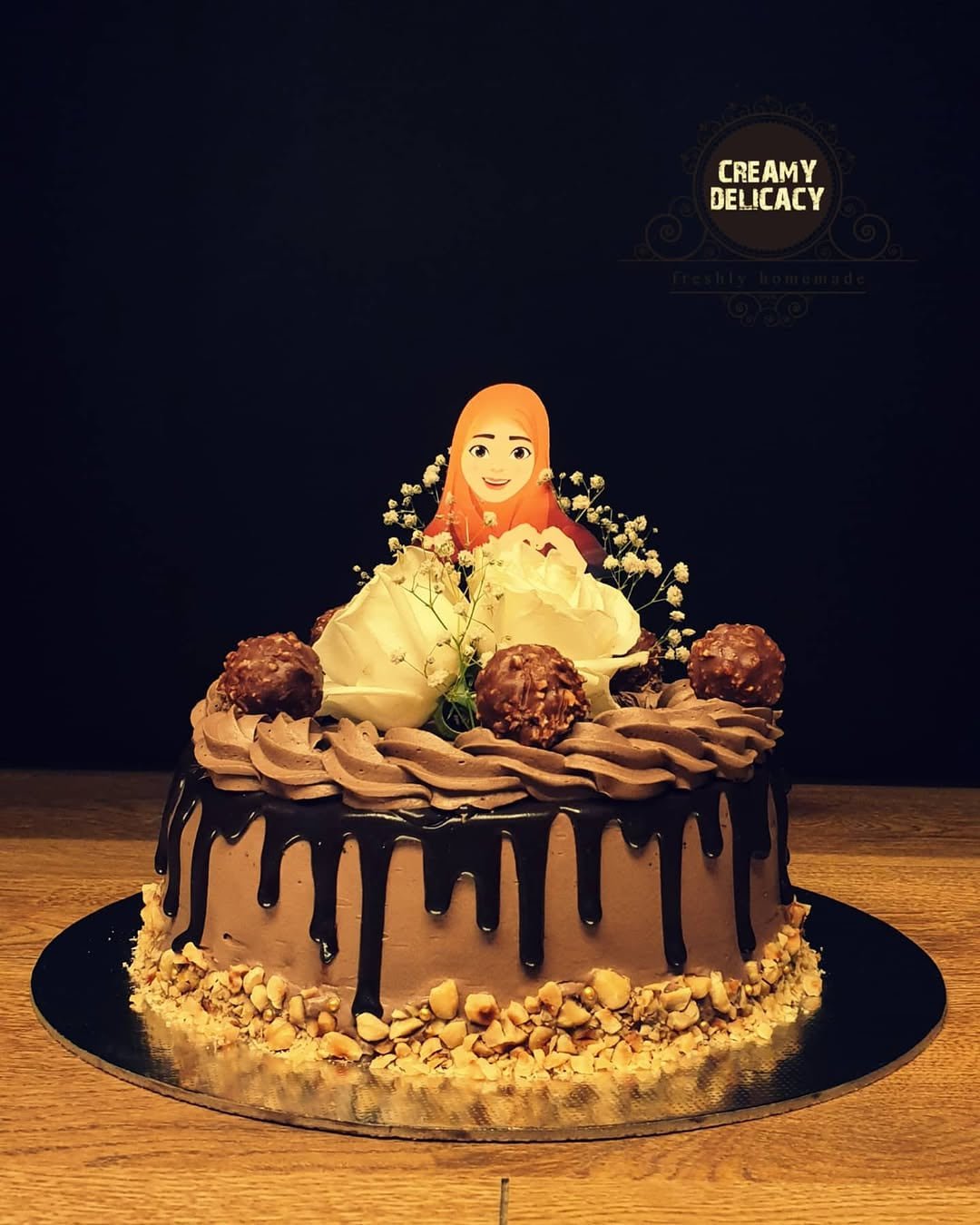 Ferrero Rocher celebration cake with a custom topper