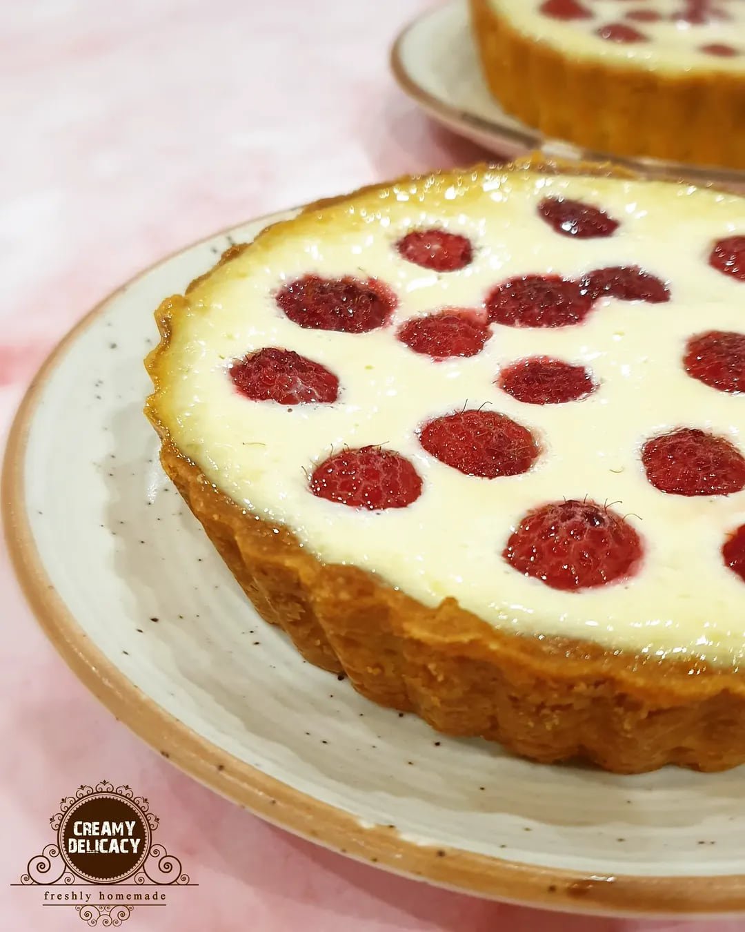 Raspberry tart dotted with farm-fresh raspberries