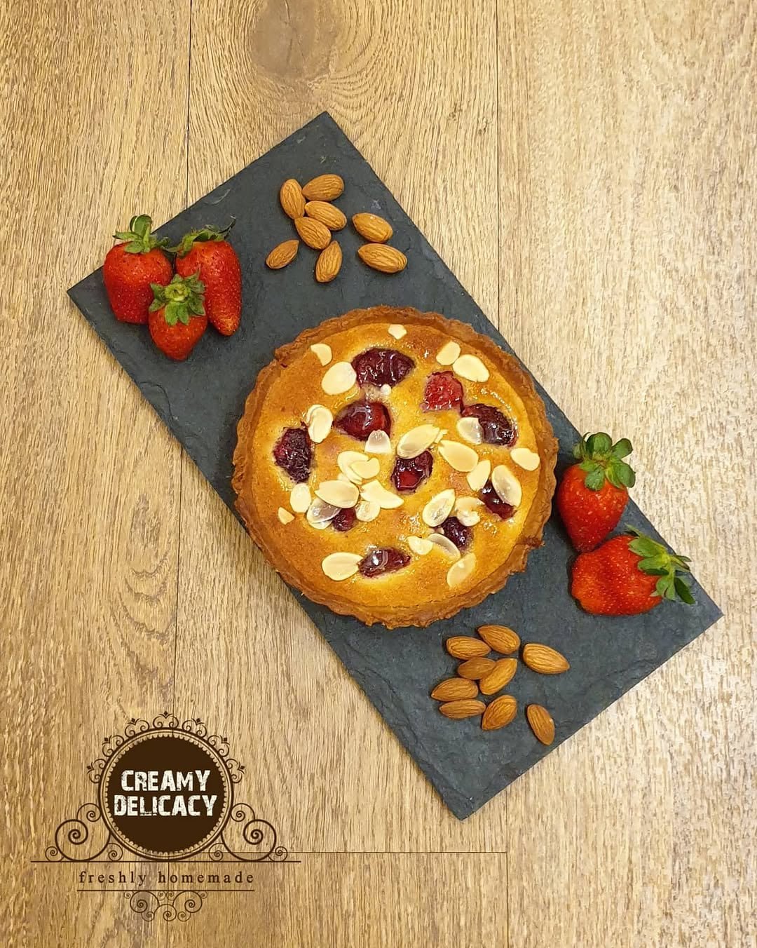 Strawberry frangipane tart with almonds and fresh strawberries